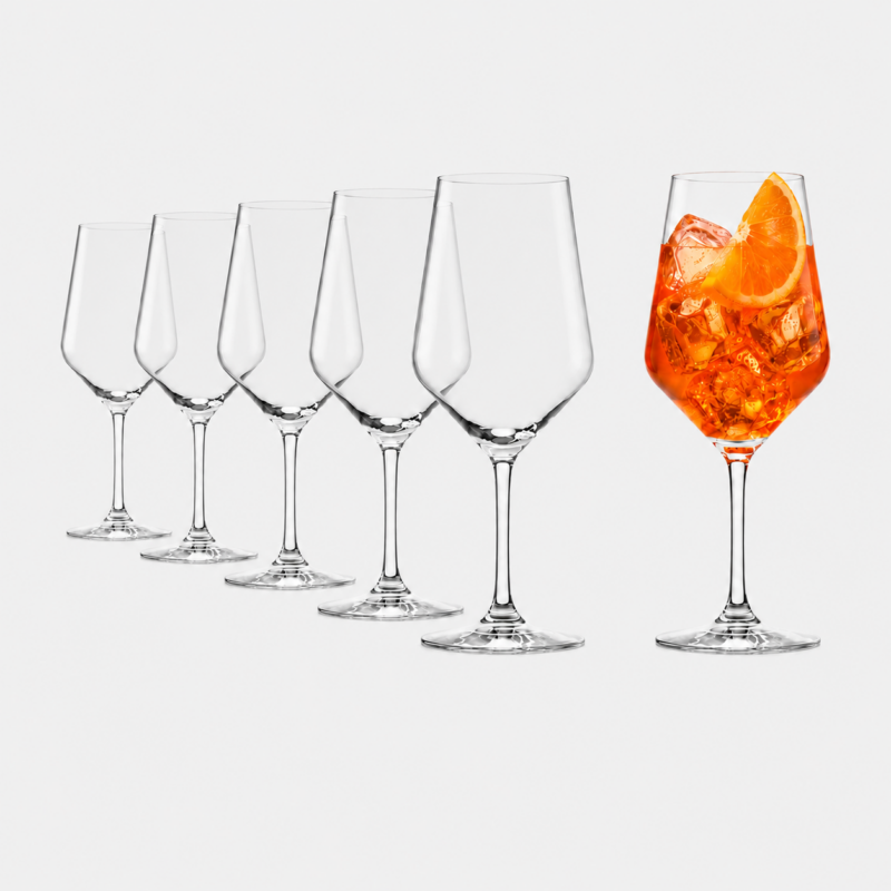 Row of empty wine glasses transitioning to a single orange cocktail with ice and orange slice on the right