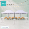Event setup with two white canopies, wooden benches and tables, and string lights overhead; price tag reads Paketpreis 269 €, Angebot für bis zu 48 Personen.