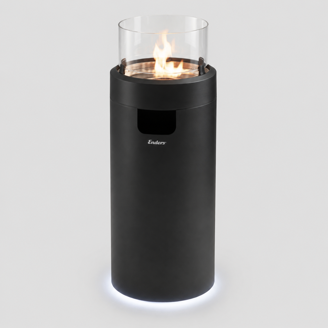 Tall black cylindrical outdoor heater with a glass enclosure and visible flame on top, emitting warmth.