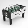 Foosball table with black and white players, green field, and handles on both sides set on a white background.